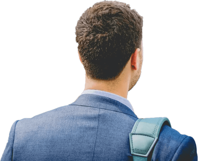 An executive with a bag on their back heading to an executive coaching session